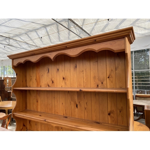 2152 - A PINE DRESSER WITH TWO DOORS, THREE DRAWERS AND UPPER PLATE RACK