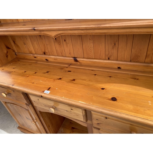 2152 - A PINE DRESSER WITH TWO DOORS, THREE DRAWERS AND UPPER PLATE RACK