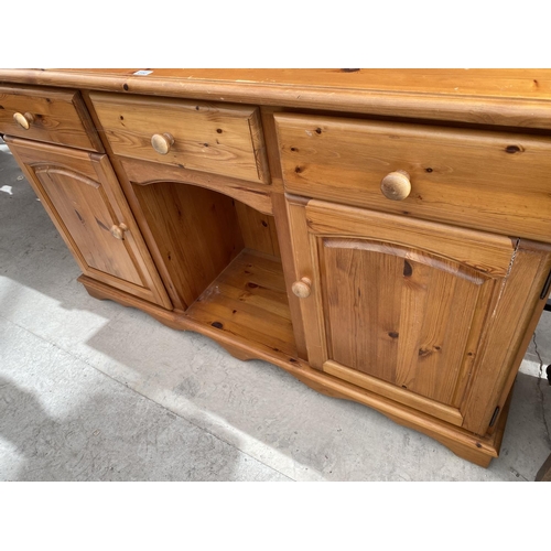 2152 - A PINE DRESSER WITH TWO DOORS, THREE DRAWERS AND UPPER PLATE RACK