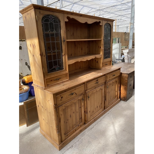 2158 - A PINE DRESSER WITH THREE DOORS, THREE DRAWERS AND TWO UPPER GLAZED DOORS