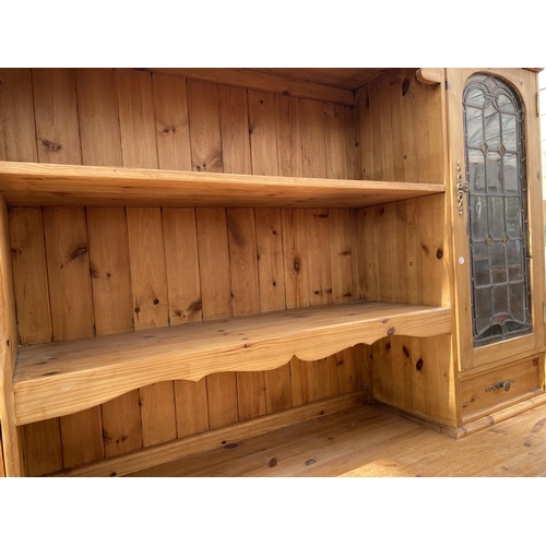 2158 - A PINE DRESSER WITH THREE DOORS, THREE DRAWERS AND TWO UPPER GLAZED DOORS