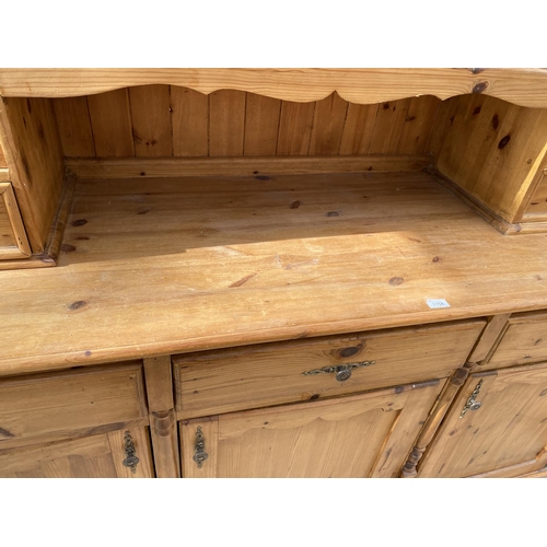 2158 - A PINE DRESSER WITH THREE DOORS, THREE DRAWERS AND TWO UPPER GLAZED DOORS