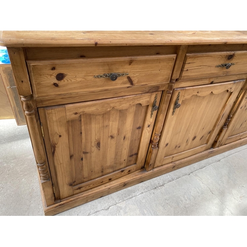 2158 - A PINE DRESSER WITH THREE DOORS, THREE DRAWERS AND TWO UPPER GLAZED DOORS