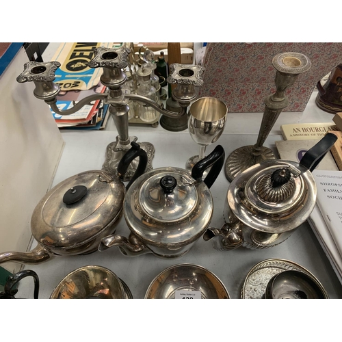 132 - A LARGE COLLECTION OF SILVER PLATED ITEMS TO INCLUDE TEAPOTS, SPOONS ETC