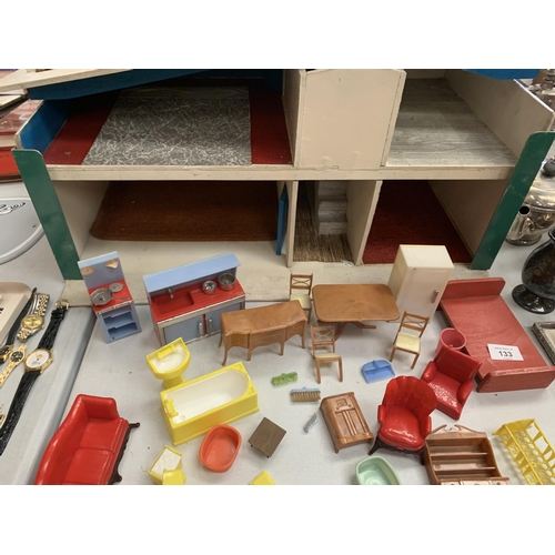 133 - A 1960'S DOLLS HOUSE WITH FURNITURE