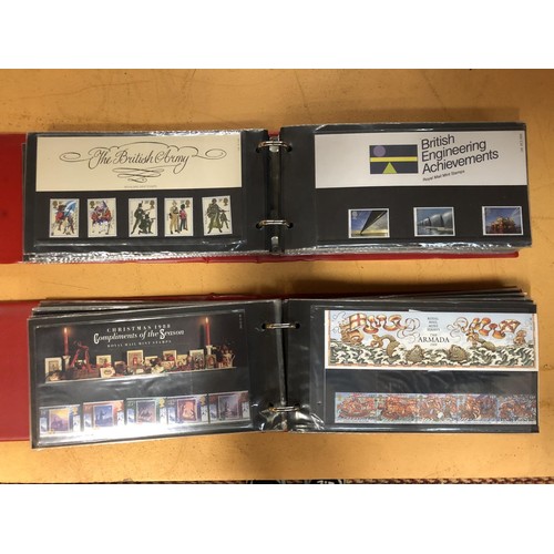 59 - GREAT BRITAIN , A SELECTION OF PRESENTATION PACKS , CONTAINED IN TWO RED BINDERS . FACE VALUE £84.