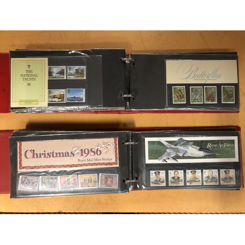 59 - GREAT BRITAIN , A SELECTION OF PRESENTATION PACKS , CONTAINED IN TWO RED BINDERS . FACE VALUE £84.