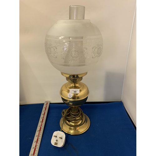 30 - A BRASS OIL STYLE LAMP WITH GLASS SHADE