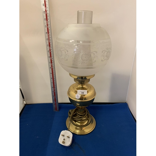 30 - A BRASS OIL STYLE LAMP WITH GLASS SHADE