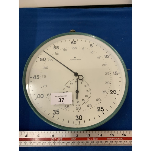 37 - A JUNGHAMS STOP WATCH STYLE CLOCK IN WORKING ORDER