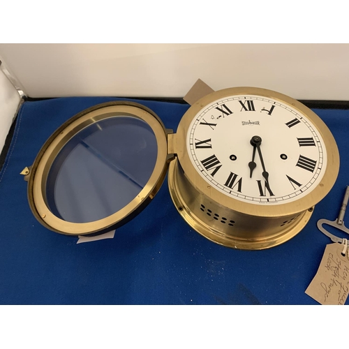 4 - A BRASS GERMAN STOCKBURGER MARITIME CLOCK WITH KEY