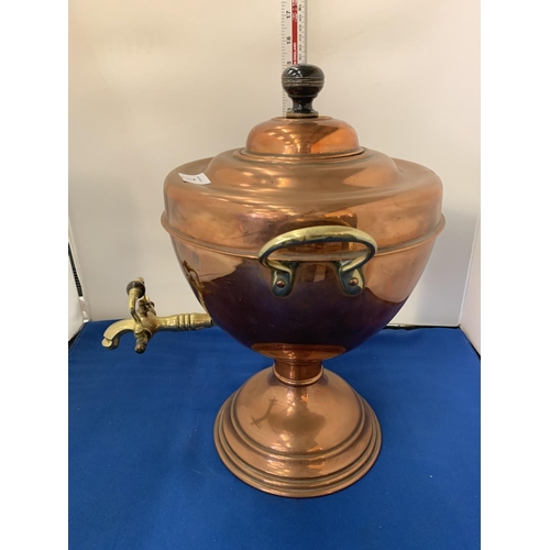 7 - A BRASS AND COPPER TWIN HANDLED URN