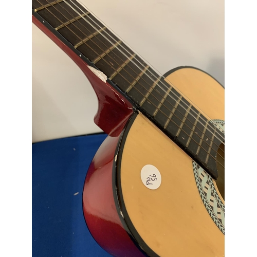 93 - A SMALL ACCOUSTIC GUITAR