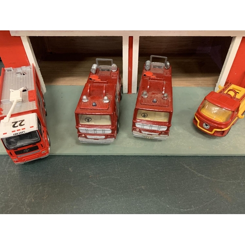 337 - A WOODEN FIRE SERVICE STATION WITH SEVEN VARIOUS FIRE ENGINES