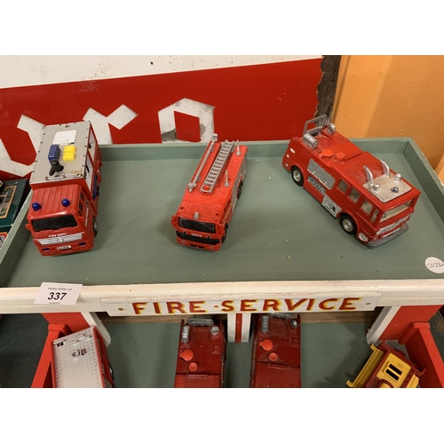 337 - A WOODEN FIRE SERVICE STATION WITH SEVEN VARIOUS FIRE ENGINES