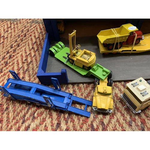 394 - A WOODEN 'TRANSPORT' GARAGE WITH TEN MATCHBOX AND CORGI MODELS OF LOW LOADERS AND PLANT