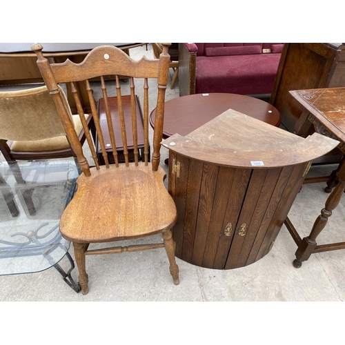 1856 - AN OAK BOW FRONT CORNER CUPBOARD AND AN OAK DINING CHAIR