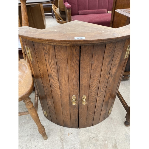 1856 - AN OAK BOW FRONT CORNER CUPBOARD AND AN OAK DINING CHAIR