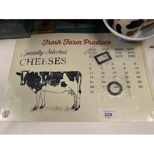 229 - A COLLECTION OF ITEMS TO INCLUDE COW RELATED ITEMS CLOCKS, MATS ETC