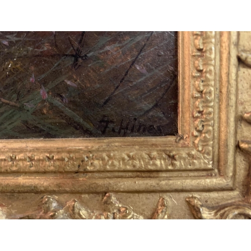 260 - A GILT FRAMED OIL ON CANVAS OF A COUNTY SCENE  SIGNED F HINES