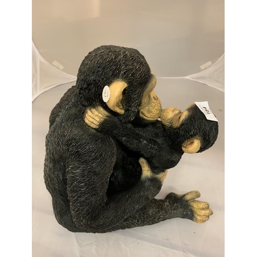 184 - A SITTING CHIMPANZEE AND BABY