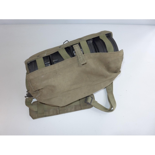 321 - A BAG CONTAINING FOUR SINGAPORE ULTIMAX 100 MACHINE GUN MAGAZINES