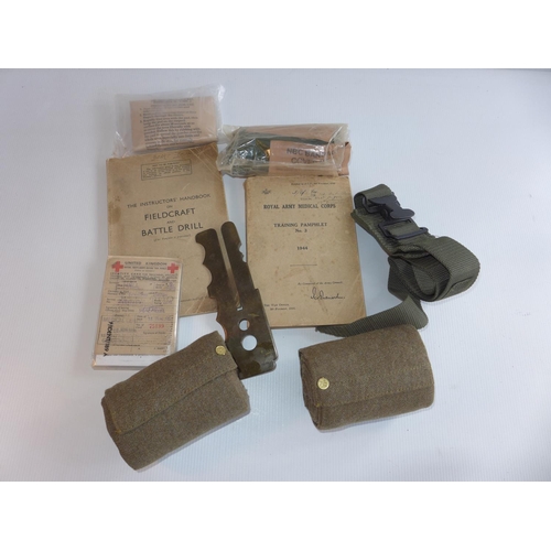 326 - A MEDICAL DECONTAMINATION KIT, BANDAGE, TWO PAIRS OF PUTTEES, BOOKLETS, WWII TOURNIQUET ETC