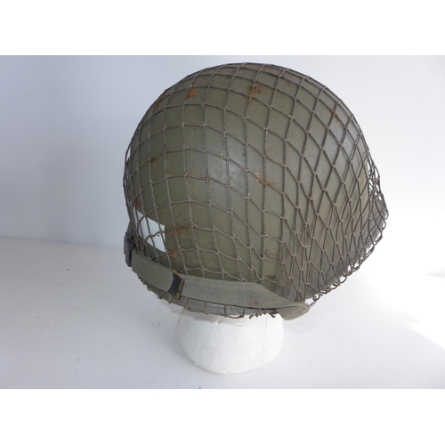 384 - A USA INFANTRYMAN'S HELMET AND LINER