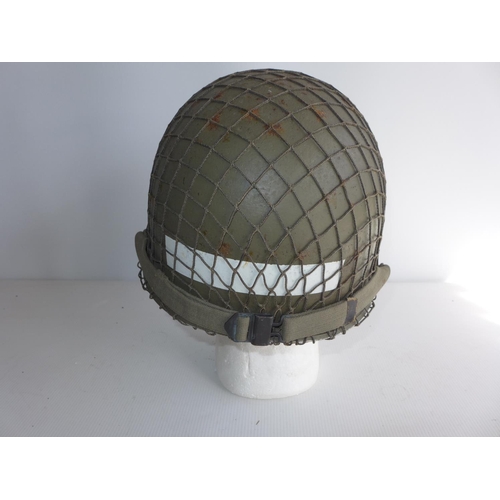 384 - A USA INFANTRYMAN'S HELMET AND LINER