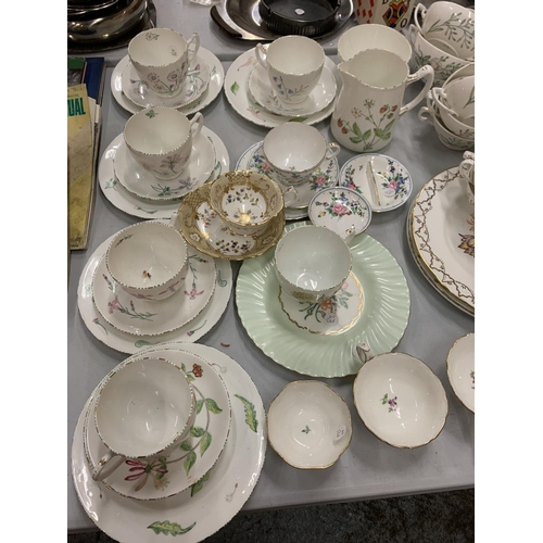 104 - AN EXTENSIVE COLLECTION OF FLORAL DECORATED TEA WARE INCLUDING CAKE STANDS