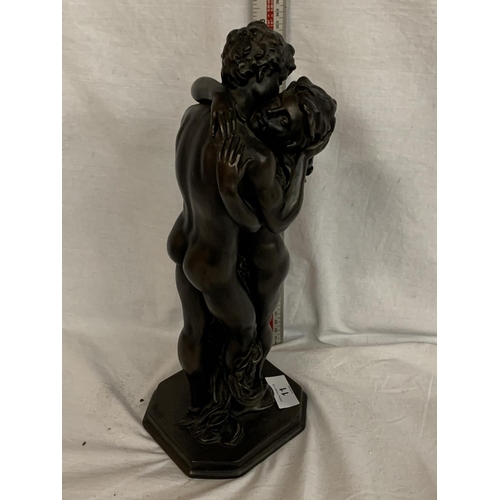 11 - A LARGE RESIN FIGURE OF A LOVING COUPLE