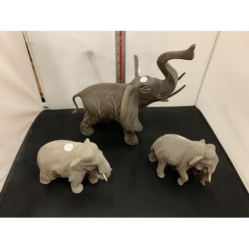 14 - A LARGE BRASS ELEPHANT AND TWO SMALLER WOODEN ELEPHANTS