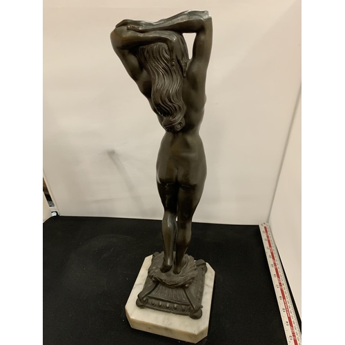 24 - A SIGNED SPELTER FIGURE OF A NUDE WOMAN ON A MARBLE BASE