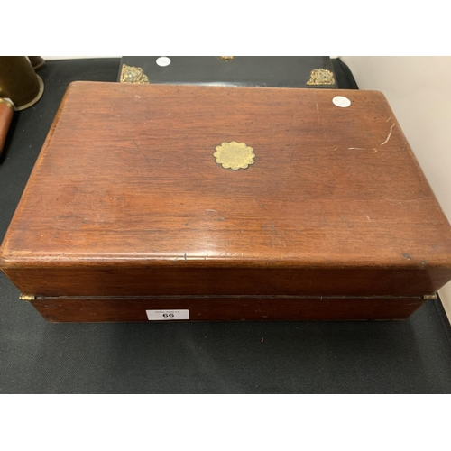 66 - A BLACK LACQUERED JEWELLERY BOX WITH GILT EDGES AND A MAHOGANY WOODEN WRING SLOPE