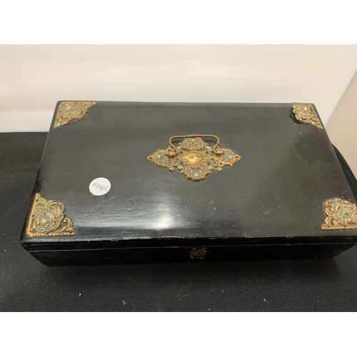 66 - A BLACK LACQUERED JEWELLERY BOX WITH GILT EDGES AND A MAHOGANY WOODEN WRING SLOPE