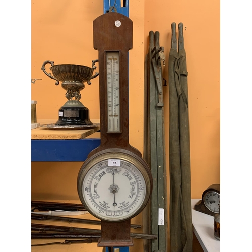 67 - A LARGE WOODEN BAROMETER