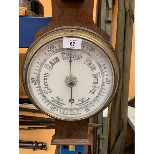 67 - A LARGE WOODEN BAROMETER