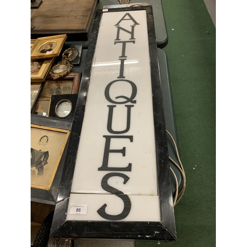 86 - A LARGE BLACK METAL LIGHT BOX SHOP SIGN 'ANTIQUES'