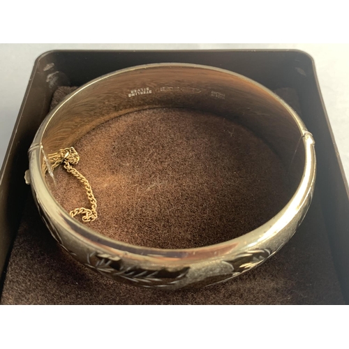 563 - A BOXED SILVER BANGLE