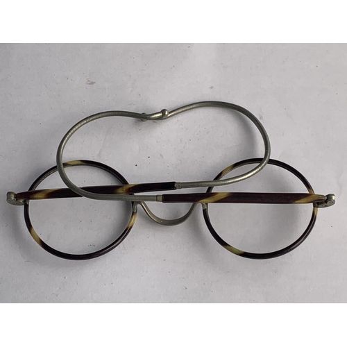 573 - A VINTAGE PAIR OF TORTOISE SHELL SPECTACLES