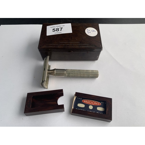 587 - A VINTAGE BAKERLITE BOX WITH A GILLETTE RAZOR AND SPARE BLADE BOXES