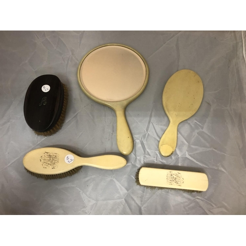 461 - A FOUR PIECE BONE MIRROR AND BRUSH SET