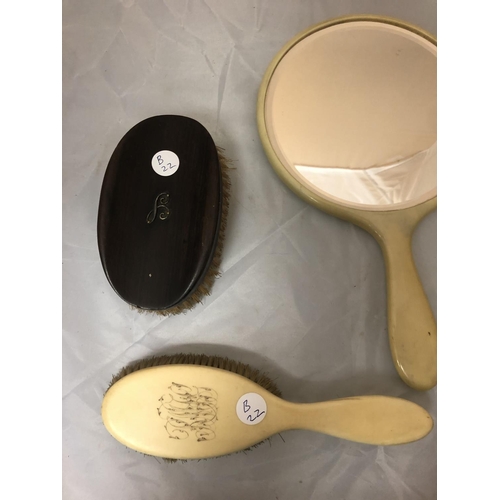 461 - A FOUR PIECE BONE MIRROR AND BRUSH SET