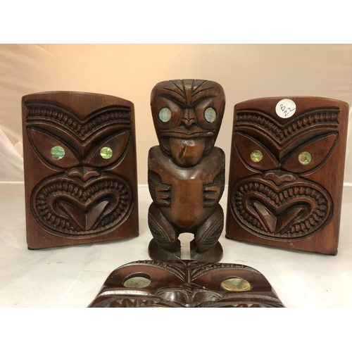 465 - VARIOUS WOODEN CARVED TRIBAL ITEMS WITH SHELL EYES TO INCLUDE A PAIR OF BOOK ENDS, A MASK AND A FIGU... 