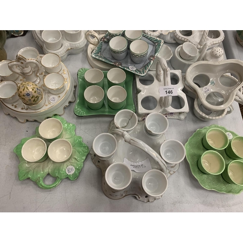 146 - A LARGE COLLECTION OF CERAMIC EGG CUPS AND HOLDERS