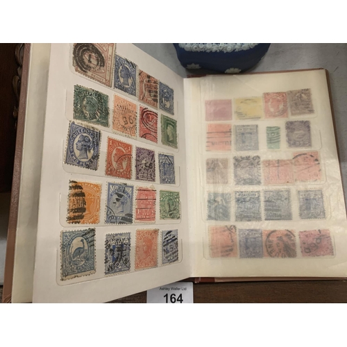 152 - AN ALBUM OF MIXED STAMPS