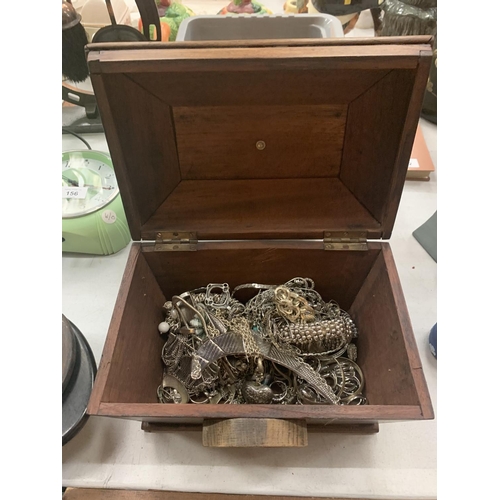 153 - A WOODEN BOX WITH SIDE HANDLES CONTAINING A QUANTITY OF WHITE METAL JEWELLERY