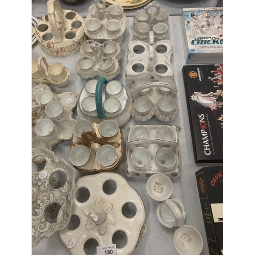 180 - A COLLECTION OF CERAMIC EGG CUPS AND HOLDERS