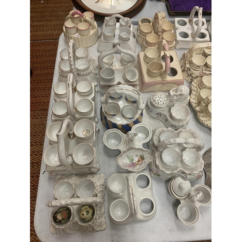 183 - A COLLECTION OF CERAMIC EGG CUPS AND HOLDERS (SEVERAL A/F)