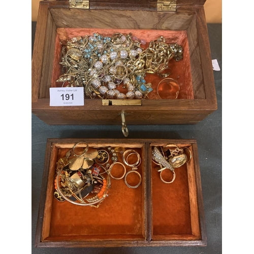 191 - AN INLAID WOODEN JEWELLERY BOX WITH MIRROR, INNER TRAY,KEY AND A LARGE QUANTITY OF COSTUME JEWELLERY